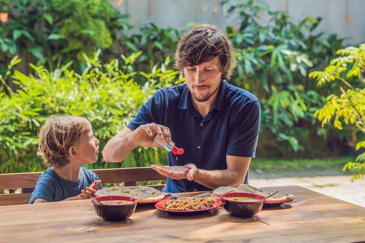 The 3 Common Hand Sanitizer Mistakes dad and son use hand sanitizer in restaurant