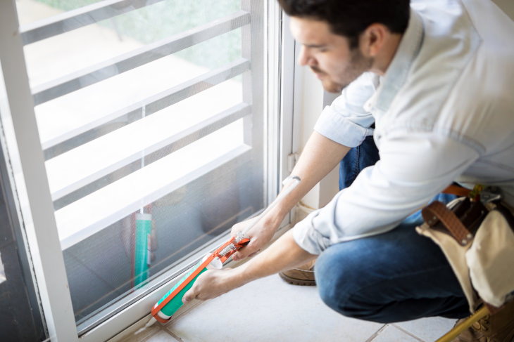 Simple Home Upgrades man Sealing windows