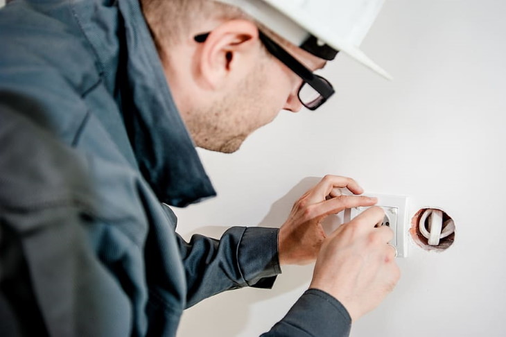 Simple Home Upgrades man changing power outlet