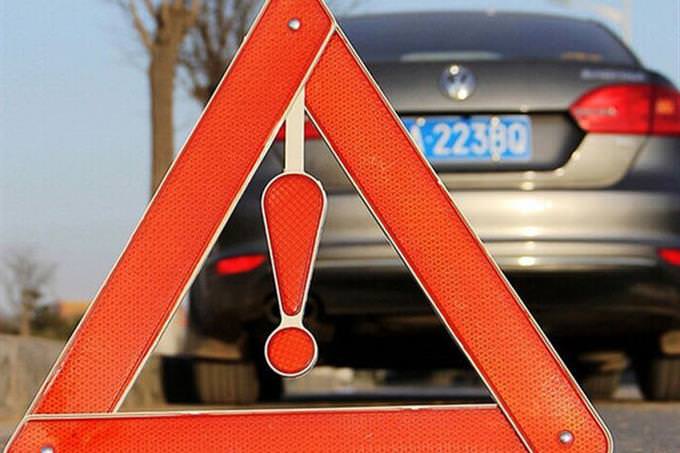 warning sign in front of car