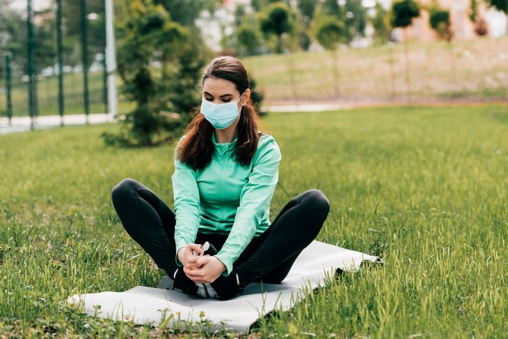 Is AC Increasing the Risk of Catching Coronavirus? woman with mask outdoors