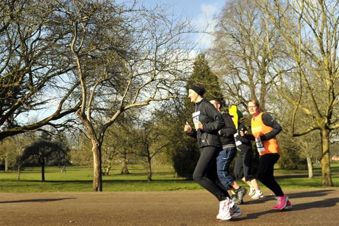 people jogging through the park