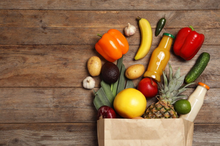 How to Go Grocery Shopping Less Often shopping bag with veggies