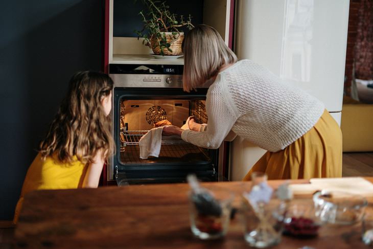 How to Go Grocery Shopping Less Often woman and girl baking