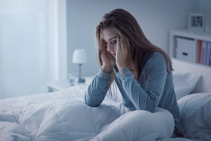 Science Backed Reasons Not to Go to Sleep Angry woman waking up upset