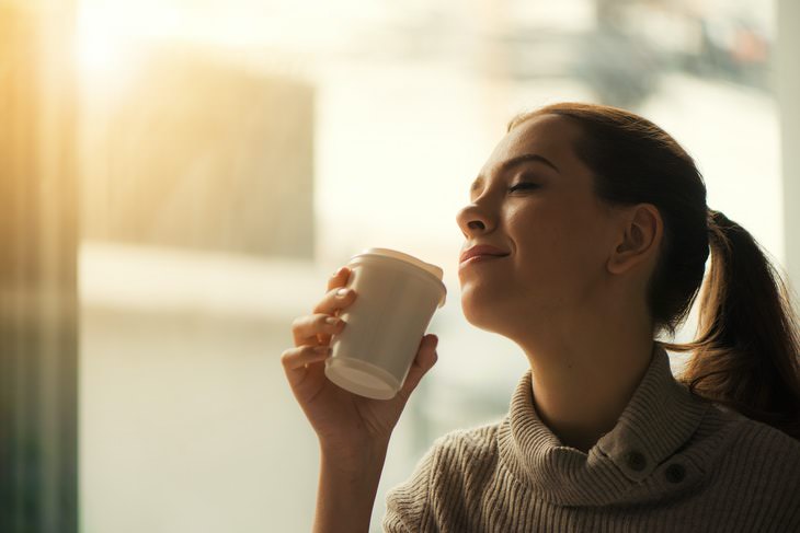 Coffee Facts woman enjoying coffee