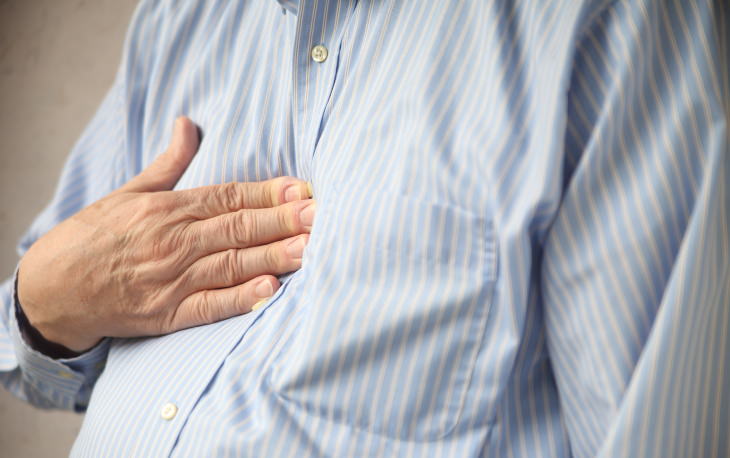 Excess Lemon Water Side Effects man with heartburn