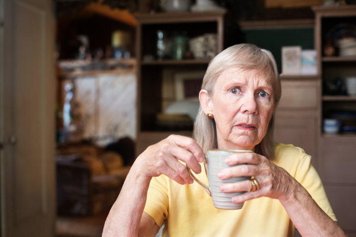 Relationship Mistakes That Push Away Your Adult Children upset woman with a mug in her hands