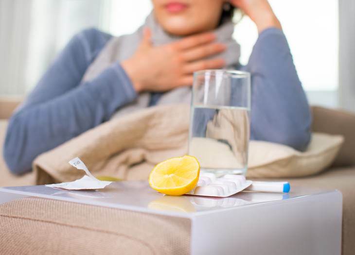 How Covid-19 Might Affect This Year’s Flu Season woman with flu symptoms and medicaiton