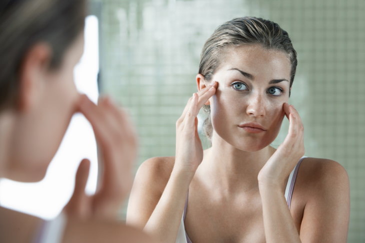 oily skin causes and tips woman with oily skin