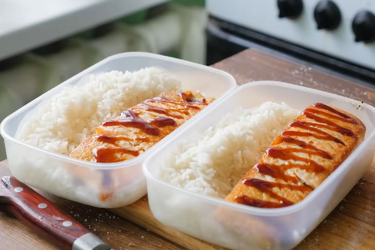 Organized Fridge cooked rice and fish in container