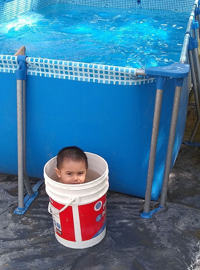 Child Logic kid in a bucket
