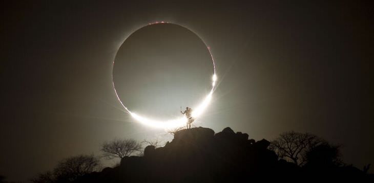 International Photography Awards 2020: Best Nature Photos, Hybrid Solar Eclipse And Maasai Warrior by Eugen Kamenew