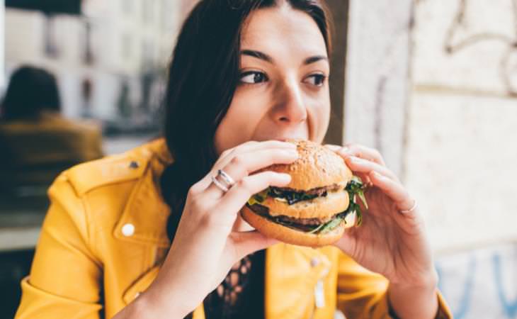 woman eating hamburger 