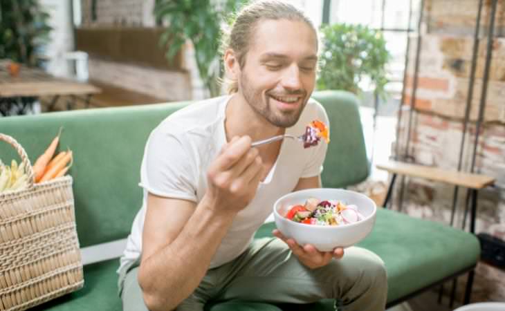 man eating salad 