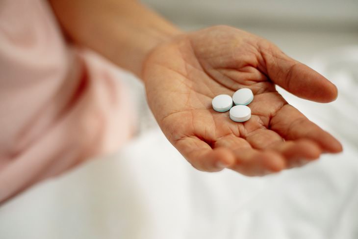 Taking Aspirin to Prevent Stroke handful of pills