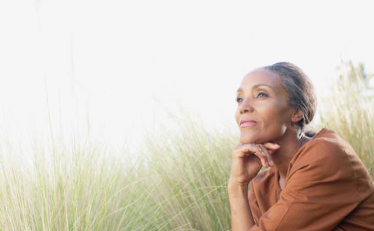 woman sitting calmly in a field