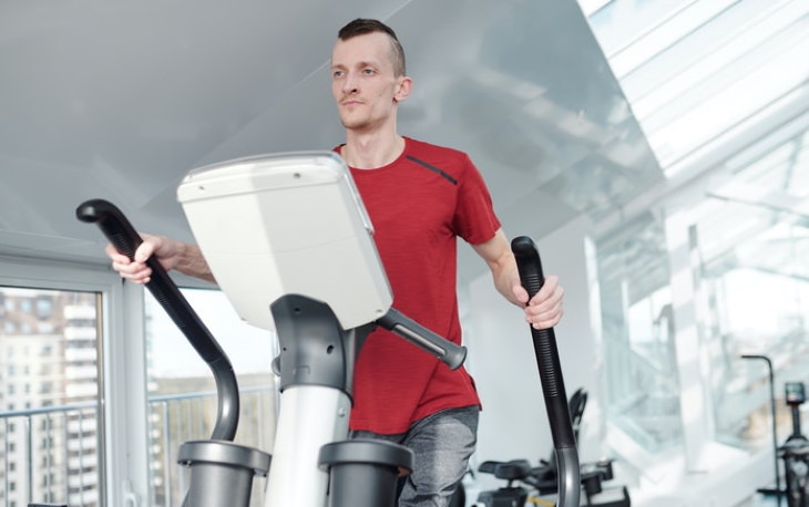 Exercise Safely With Arthritis man on the elliptical