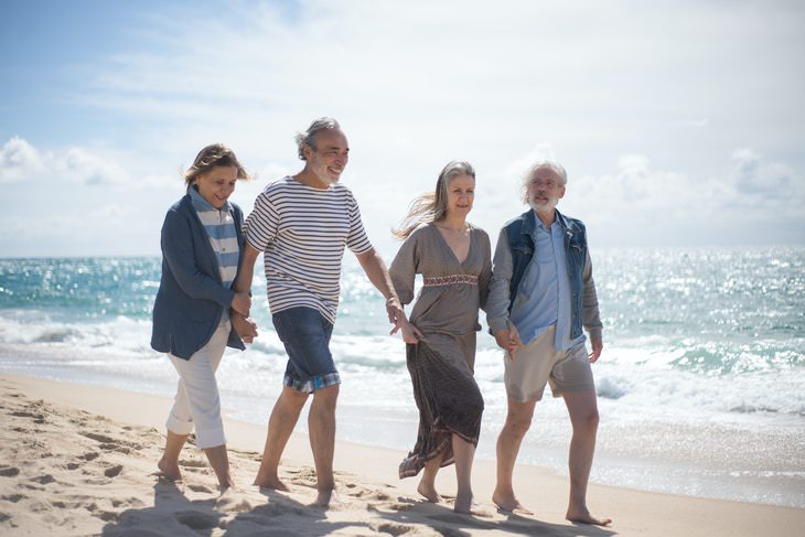 Walking Routine For Seniors couples walking on the beach