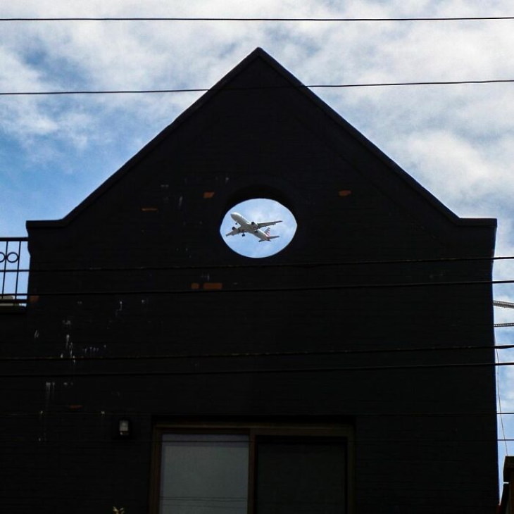 Well Timed Photos by Eric Kogan plane in building