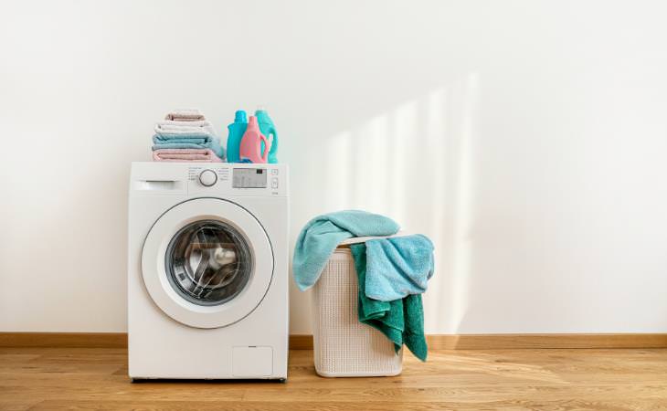 laundry machine with detergents and laundry basket 
