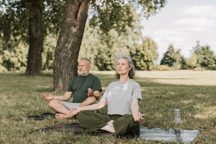 Breathing Exercises For Weight Loss man and woman meditating under a tree