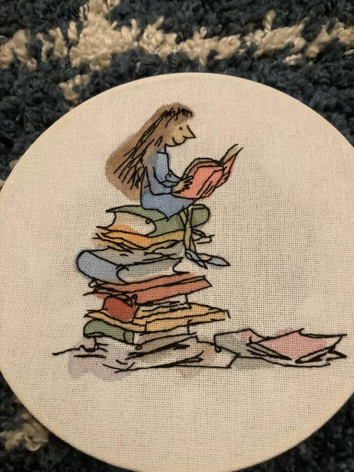 Embroideries girl and books