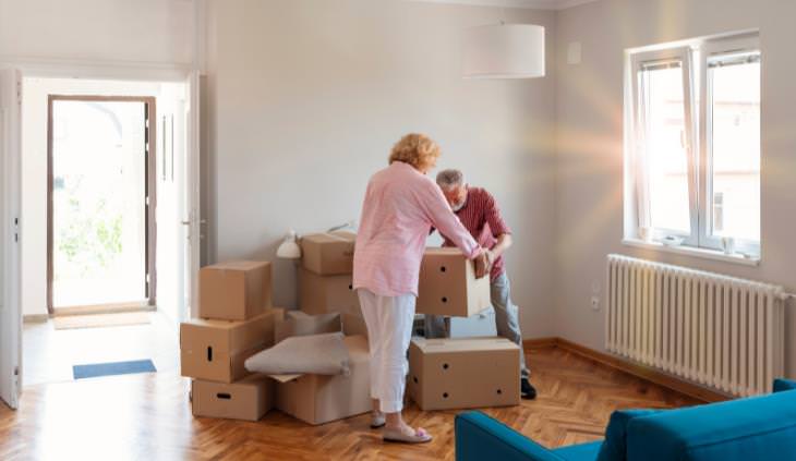 Elderly couple moving in to new home