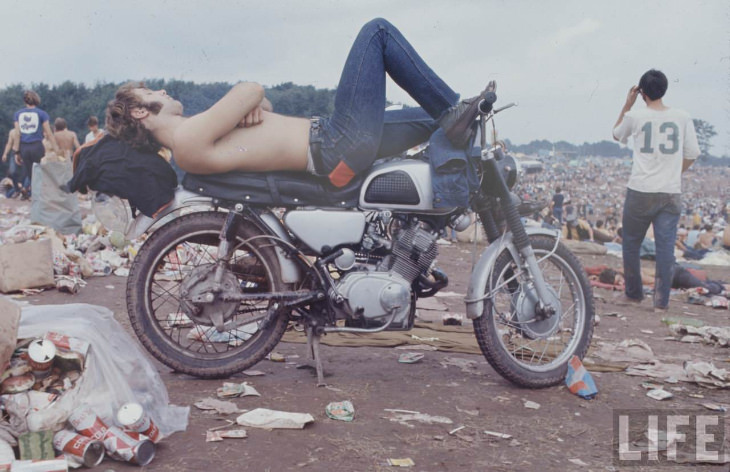 Woodstock young man sleeping on bike 