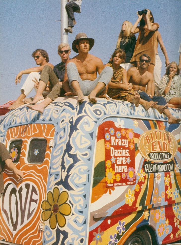 Woodstock people sitting on colored van 