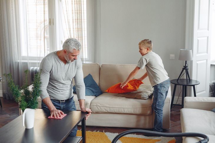 Quick Cleaning Tips man and boy cleaning living room