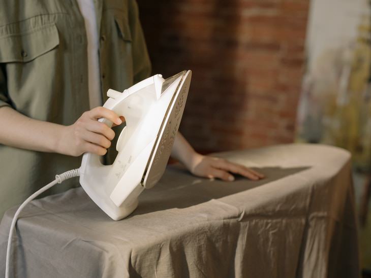 How to Clean an Iron woman ironing