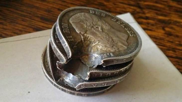19 Images Showcasing the World’s Endless Wonders, These coins were in a soldier's pocket during World war I