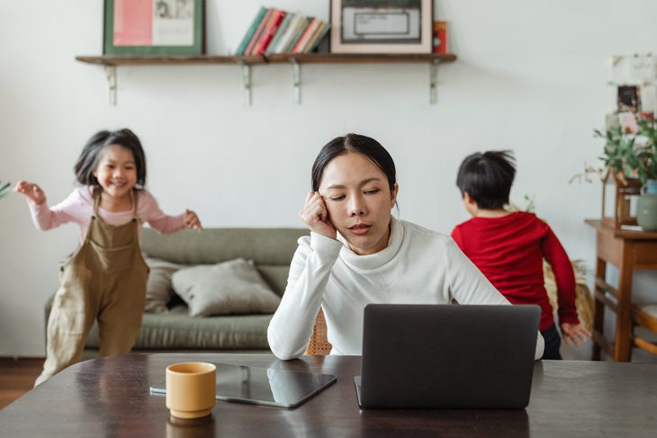 Iodine Deficiency tired woman in front of laptop