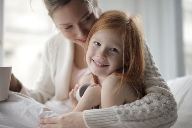 Why Kids Need Hugs mom and daughter hugging