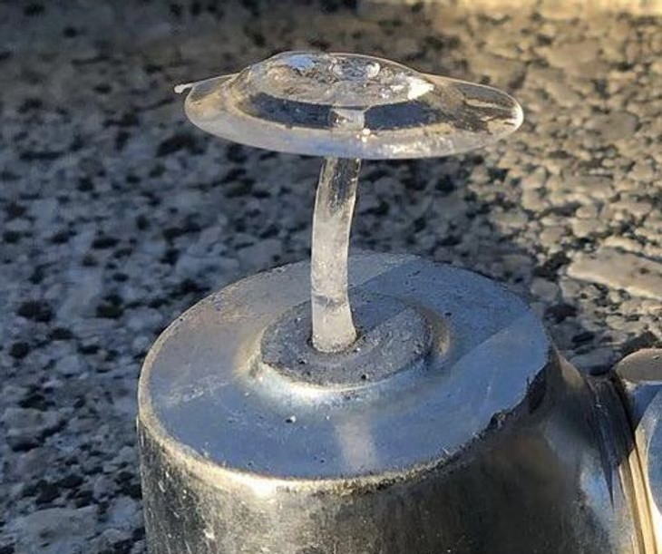 Photos of Nature The frozen water in this water fountain looks like a transparent mushroom