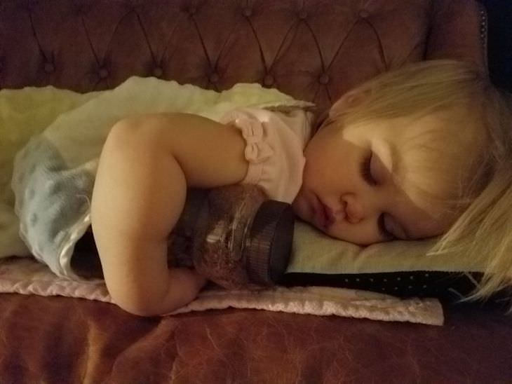 18 Photos of Kids in Hilariously Weird Situations, girl sleeping with a peanut jar