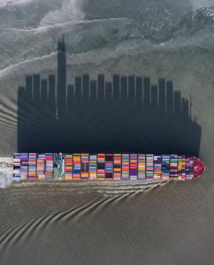 21 Stunning Spots Around the World, cargo ship casting a shadow