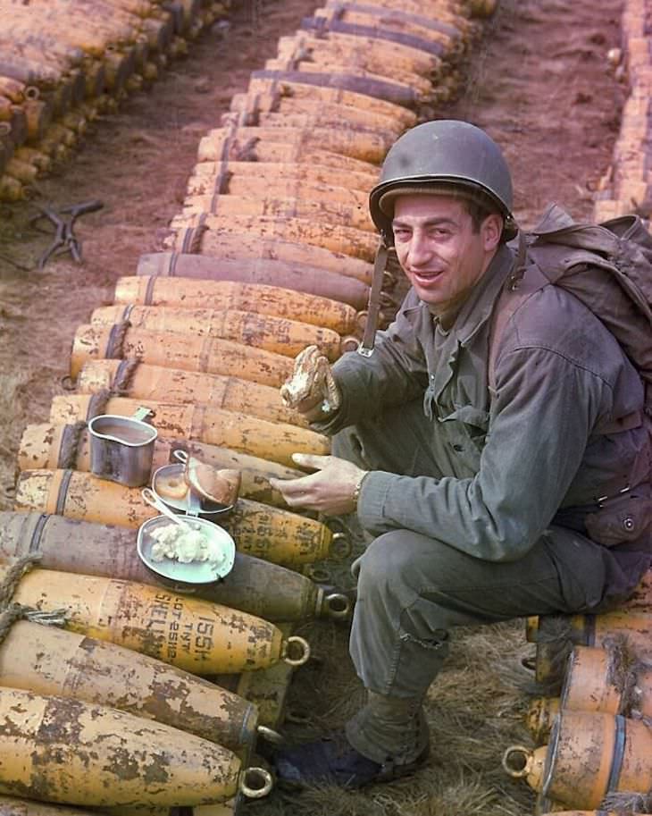 Rare and Beautifully Colorized Historical Photo A soldier eating lunch, name and place unknown, World War II
