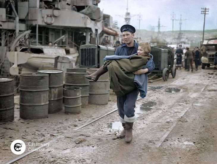 Rare and Beautifully Colorized Historical Photo A Norwegian child being carried to an ambulance
