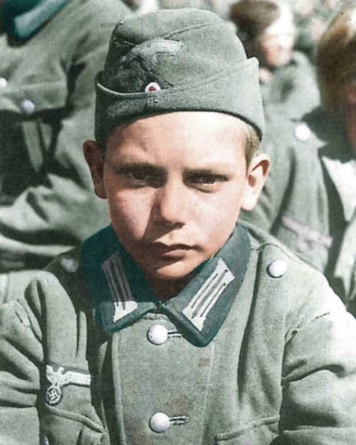 Rare and Beautifully Colorized Historical Photo A member of the Hitler Youth aged 13, 1945