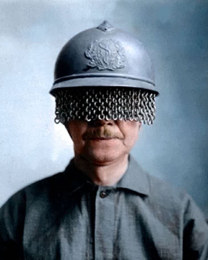 Rare and Beautifully Colorized Historical Photo French soldier with a medic (according to the badge) steel helmet covered with a built-on chain screen to protect a soldier's eyes from rocks, shells, and other fragments, 1918