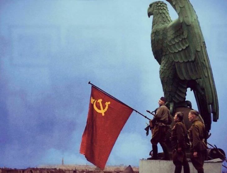 Rare and Beautifully Colorized Historical Photo Soldiers of the Red Army waive the Soviet Union flag somewhere in Berlin, May 3, 1945