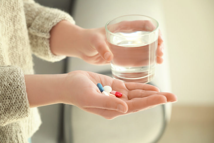 Common Myths Surrounding Antibiotics, woman taking pills