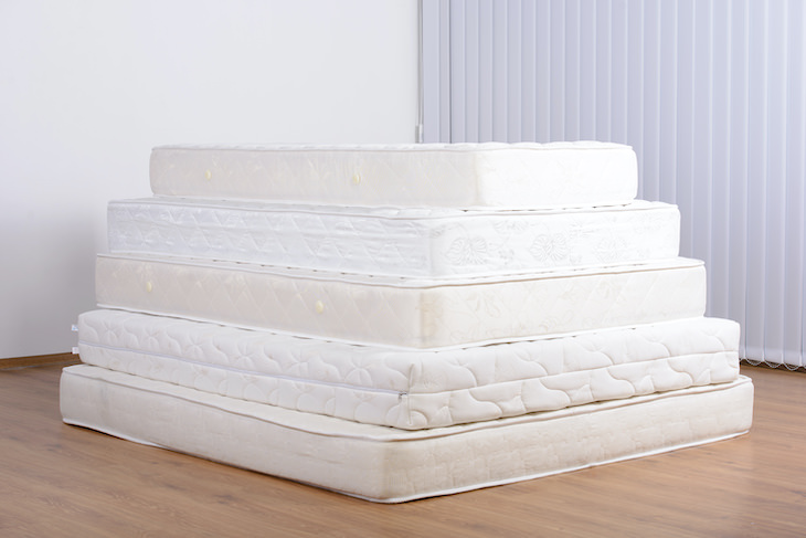 How To Tell If a Mattress Contains Toxic Chemicals pile of mattresses