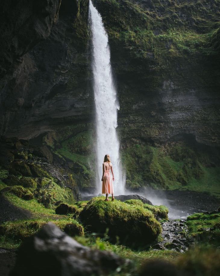 Stunning Landscape Photos by Alexander Ladanivskyy woman and waterfall