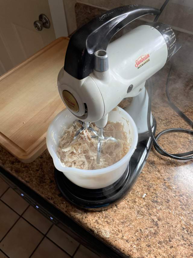 Hacks shred chicken with the help of a hand or stand mixer