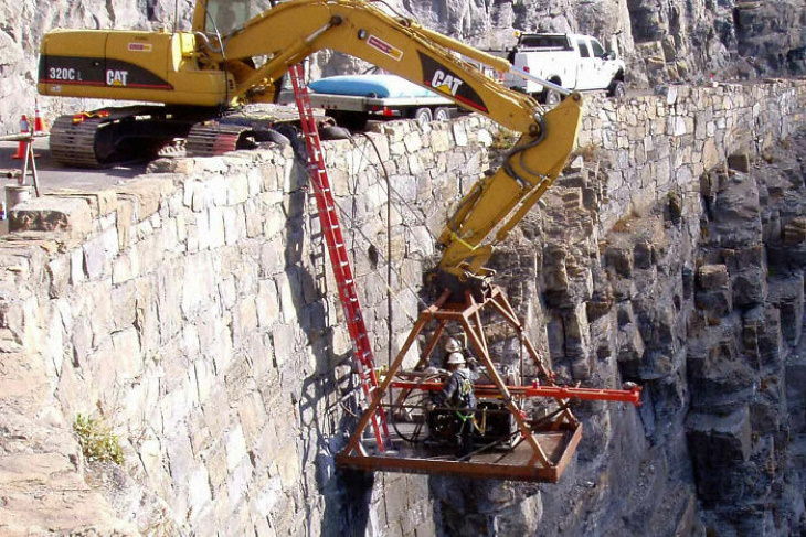 Construction Fails hanging by the ladder