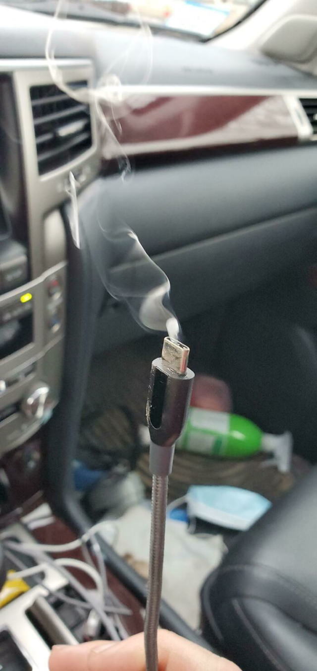 Tech Fails phone charging cable into the cigarette lighter outlet