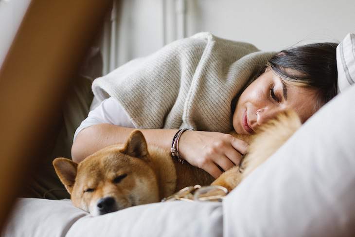 Unique Sleeping Habits From Around the World sleeping with pets